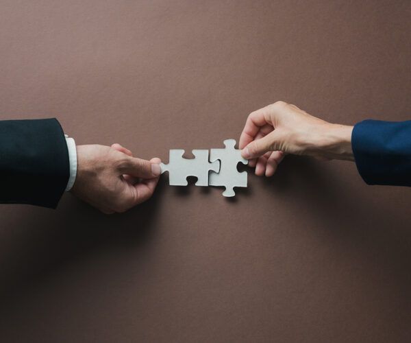 Major Firms Consolidate Power Through High-Stakes Deals, Raising Concerns Over Competition